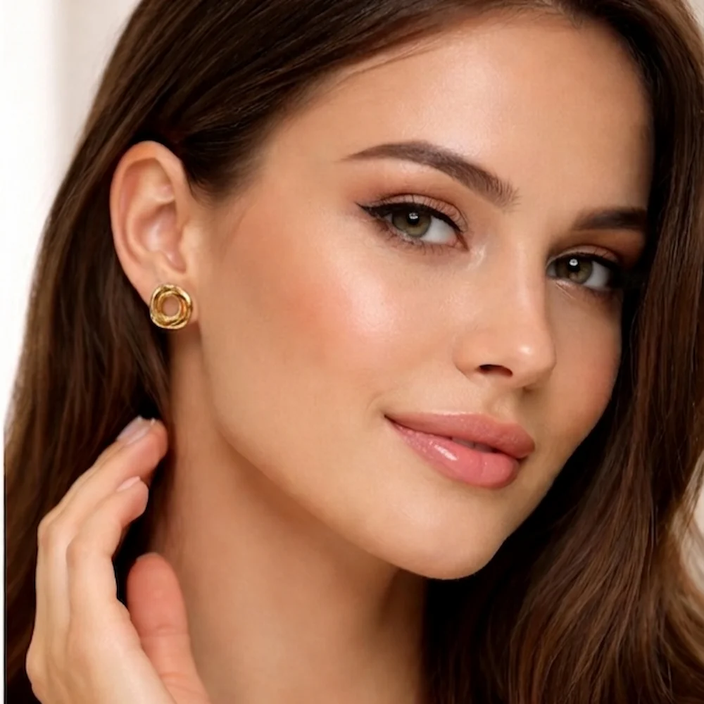 A model wearing Orbital Studs